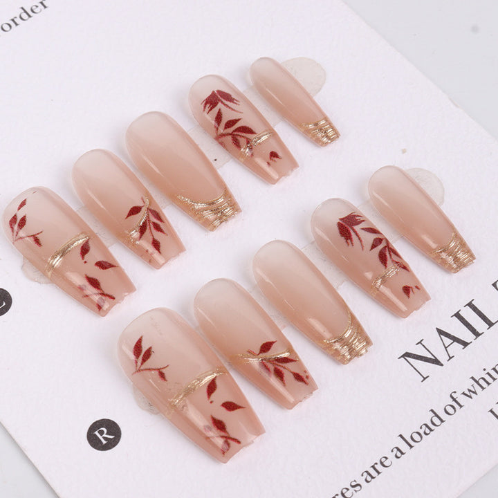 Künstlerisches Press-On-Nägel-Set mit floralem Design und goldenen Akzenten