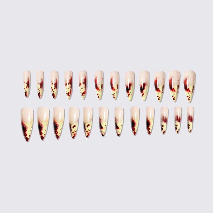 Kunstnagelset mit blutigen Akzenten und elegantem Stiletto-Design Karnz