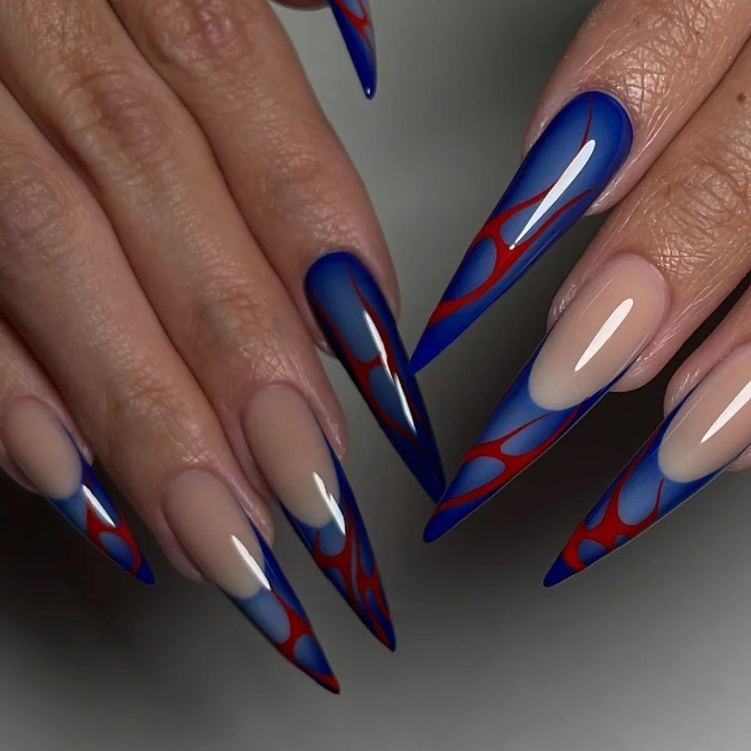 Kunstvolle Stiletto-Nägel mit farbenfrohen Designs und kreativen Akzenten Karnz
