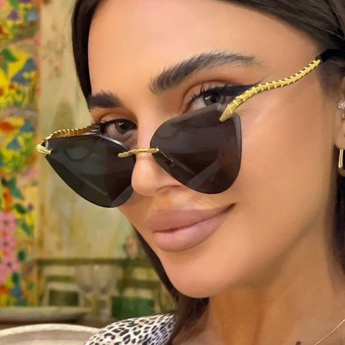Damen Cat-Eye Sonnenbrille mit einzigartigem goldenen Rahmendesign und schützenden Gläsern Karnz