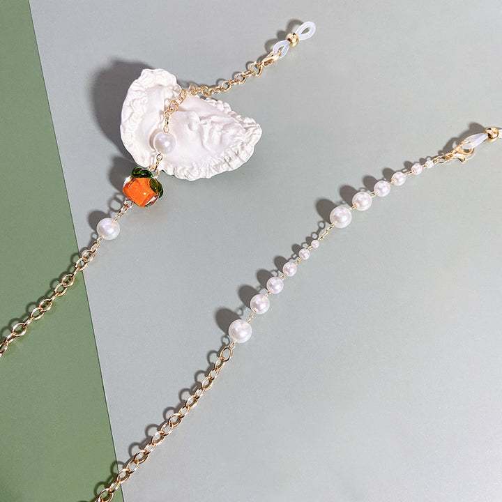 Elegante Kette mit Perlen und Rubinen Karnz