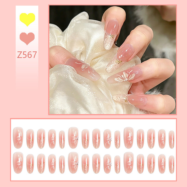 Kunstnagelset mit filigranen Blumen- und Glitzerelementen Karnz