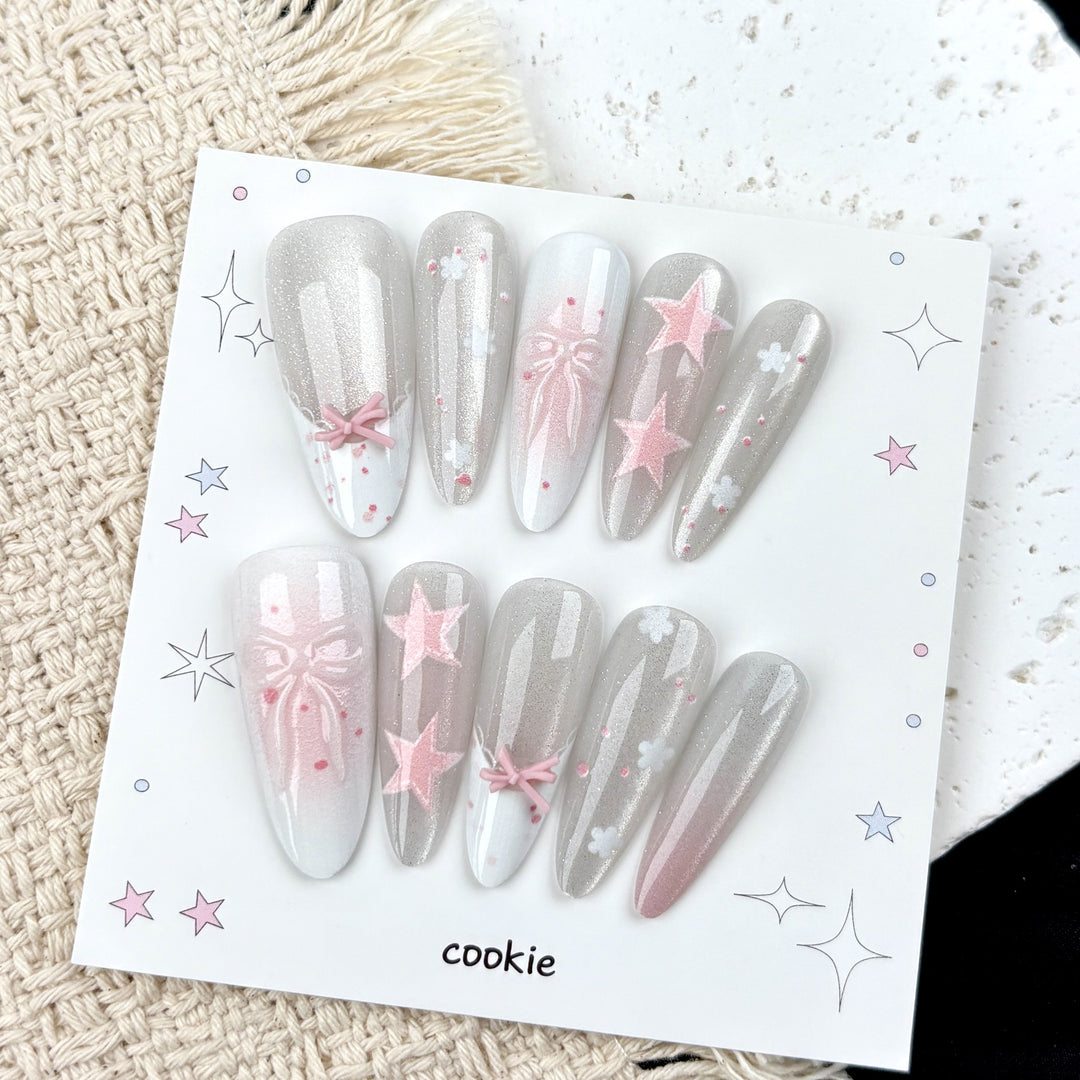 Dekorative Press-On Nagelkunst Set mit Sternen und Schleifen