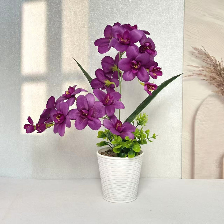 Künstliche Orchideenpflanzenanordnung für die Innendekoration zuhause