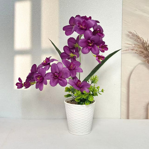 Künstliche Orchideenpflanzenanordnung für die Innendekoration zuhause