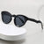 Damen modische Sonnenbrille mit feline Features Karnz