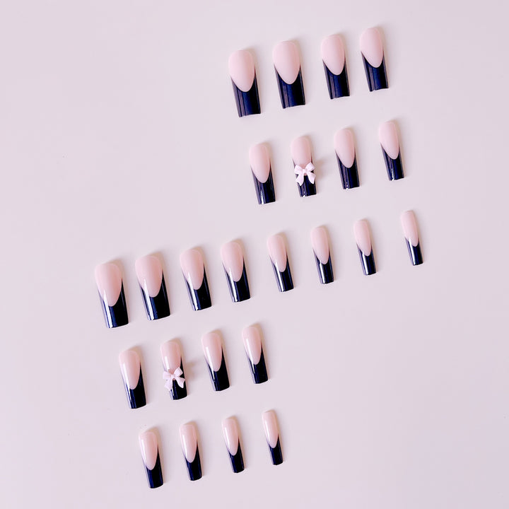 Kunstvolle Nagelverlängerungen mit Schleifen-Design Karnz