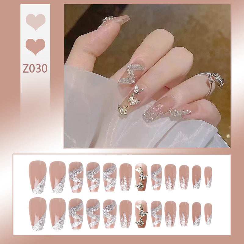 Kunstnagelset mit funkelnden Schmetterlingen und glitzernden Verzierungen Karnz