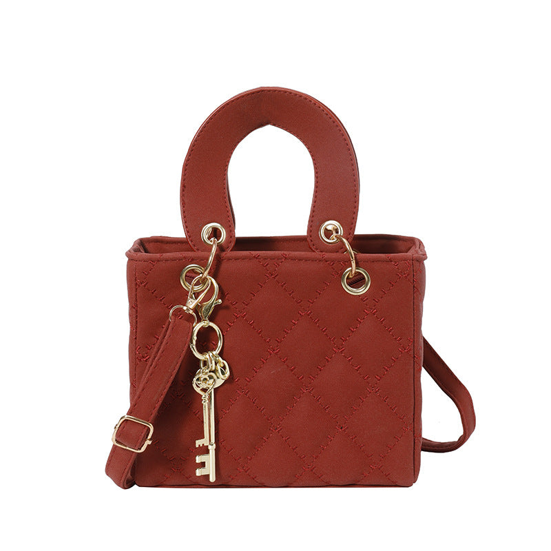 Luxuriöse Metallic Stepphandtasche