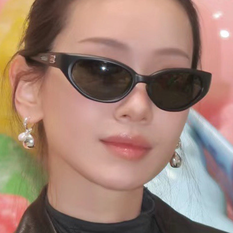 Damen extravagante Sonnenbrille mit geschwungenem Design Karnz
