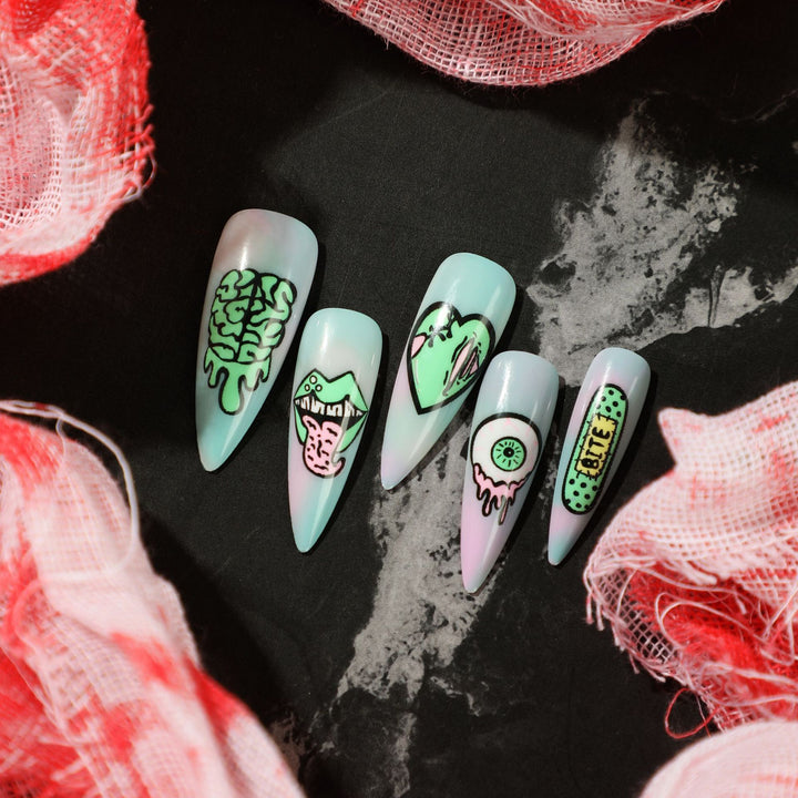 Kunstvolle Stiletto-Nägel mit kreativen Motiven und detailgetreuer Gestaltung Karnz