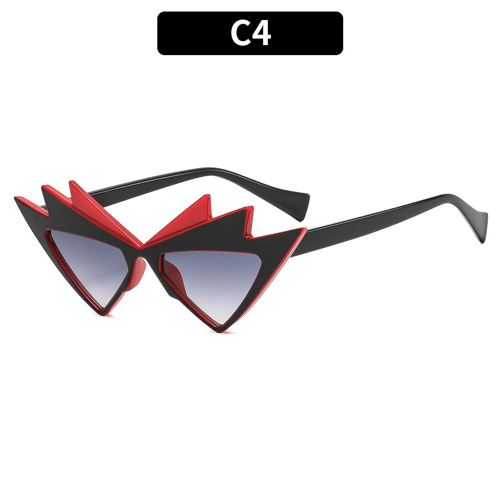 Kühne Katzenaugen-Sonnenbrille mit einzigartigem grafischem Rahmen