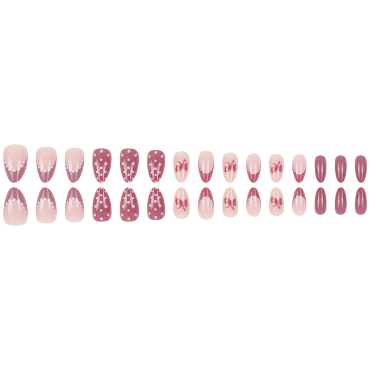 Künstlerisches Press-On-Nagelset mit Schleife und gepunktetem Design Karnz