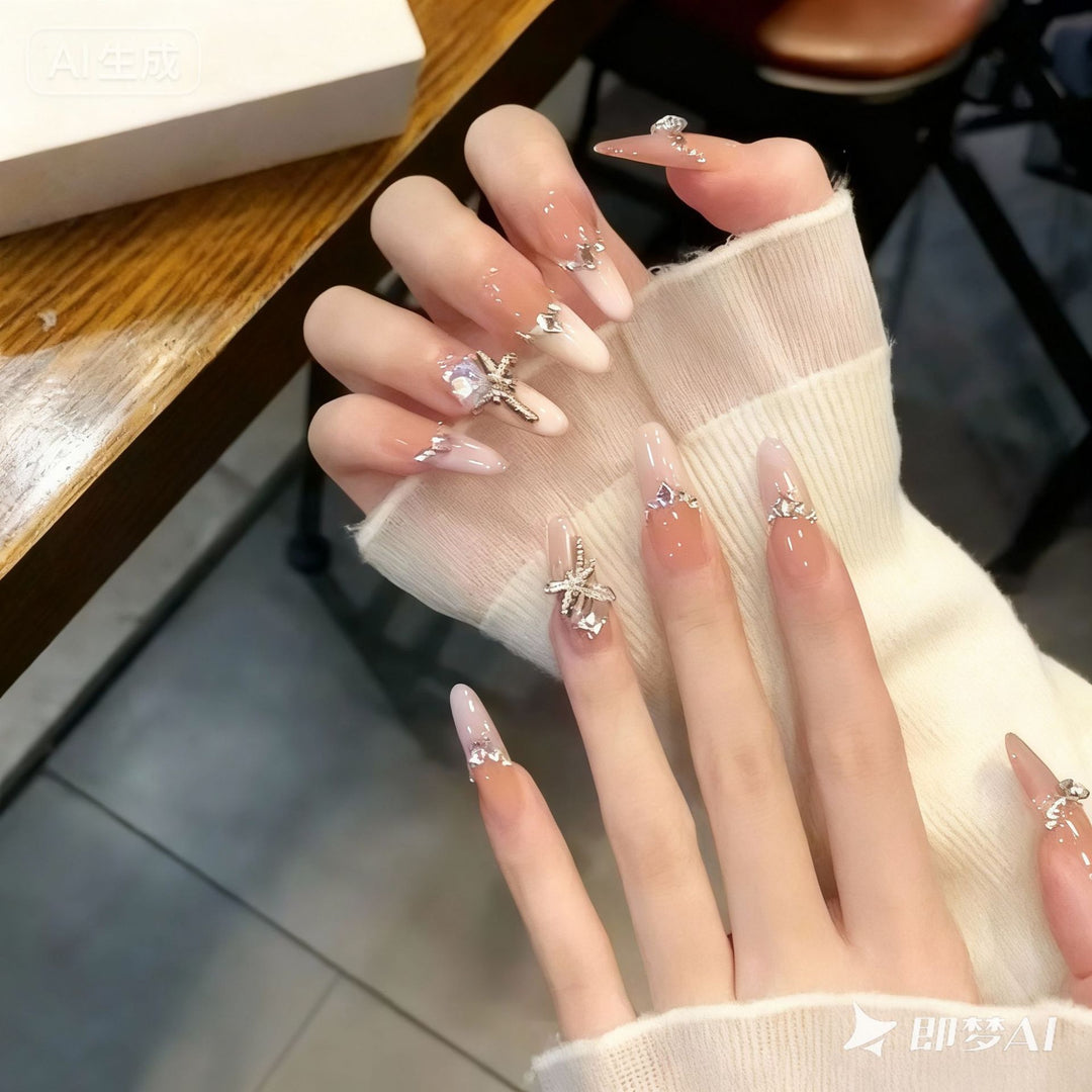 Kunstnagelset mit eleganten Kristallverzierungen und Ombre-Effekt Karnz