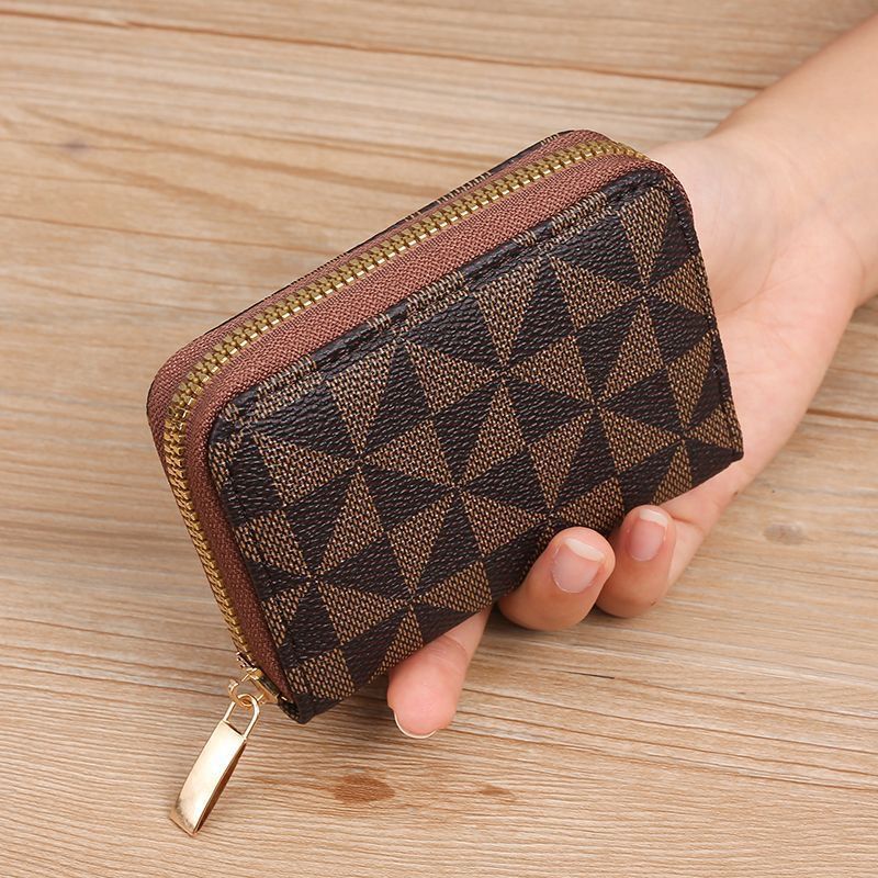 Geometrisch gemusterte Reißverschluss-Münztasche Karnz