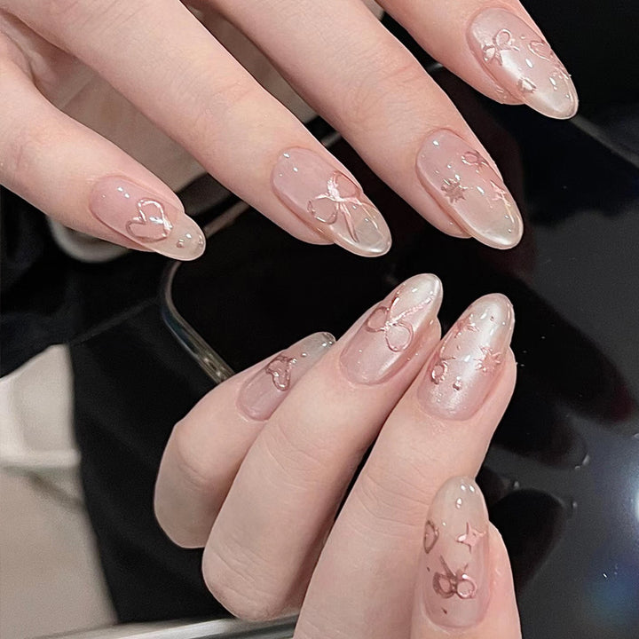 Elegante künstlerische Press-On-Nagelkunst mit Schleifen- und Herzdesigns Karnz