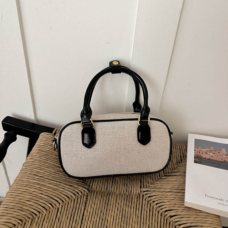 Vintage-inspirierte glänzende Handtasche