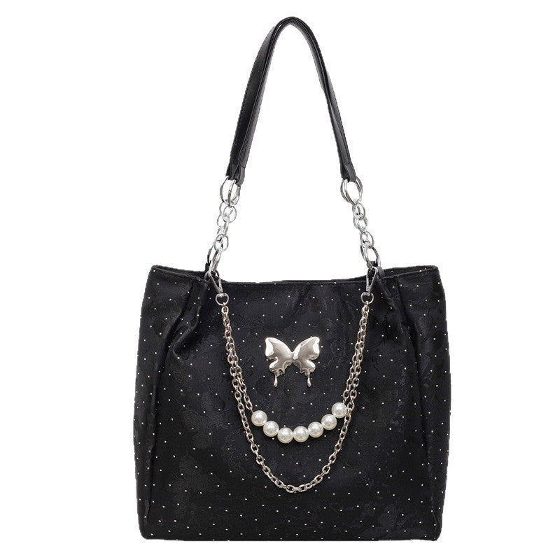 Elegante Handtasche mit Perlendetails Karnz