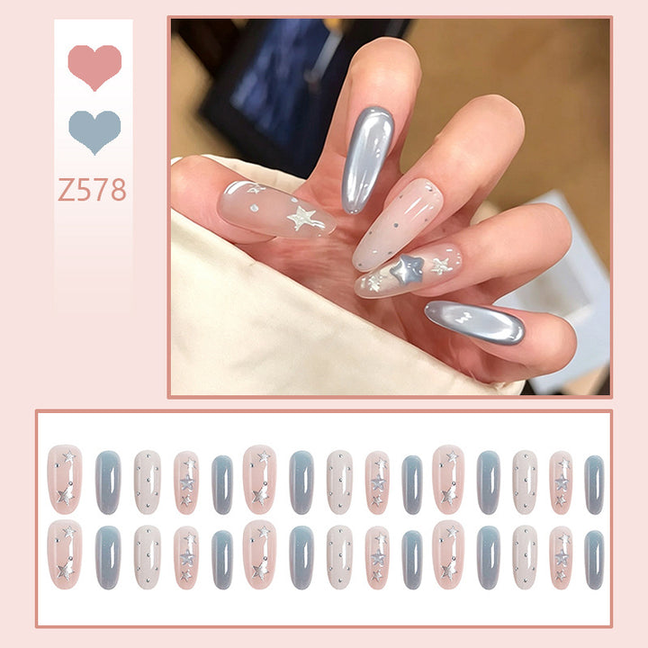Kunstnagelset mit funkelnden Sternenmotiven Karnz