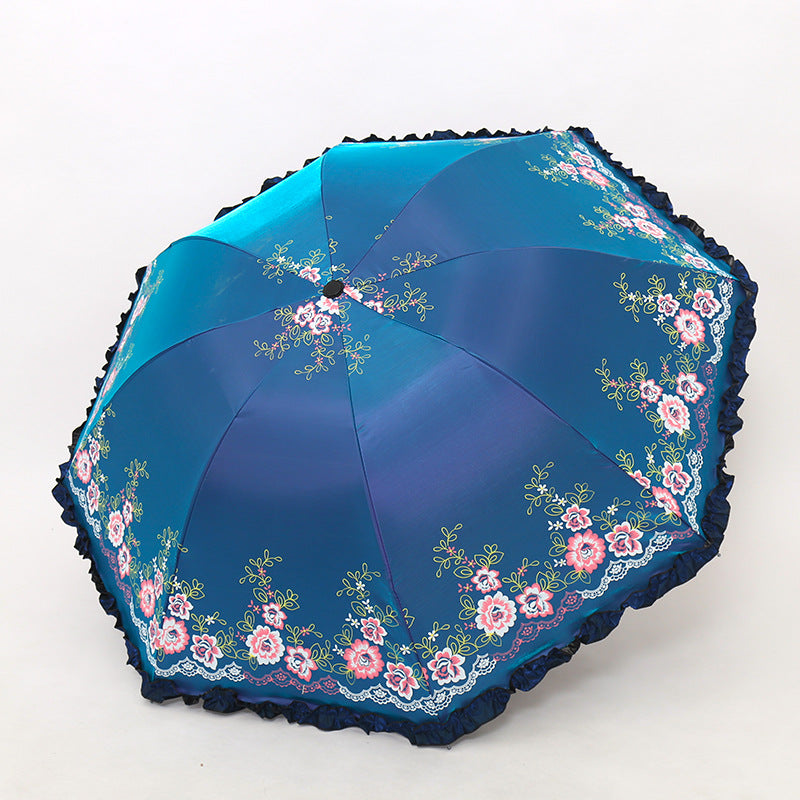 Damen Regenschirm mit fröhlichem Blumendruck und Wellenrand Karnz