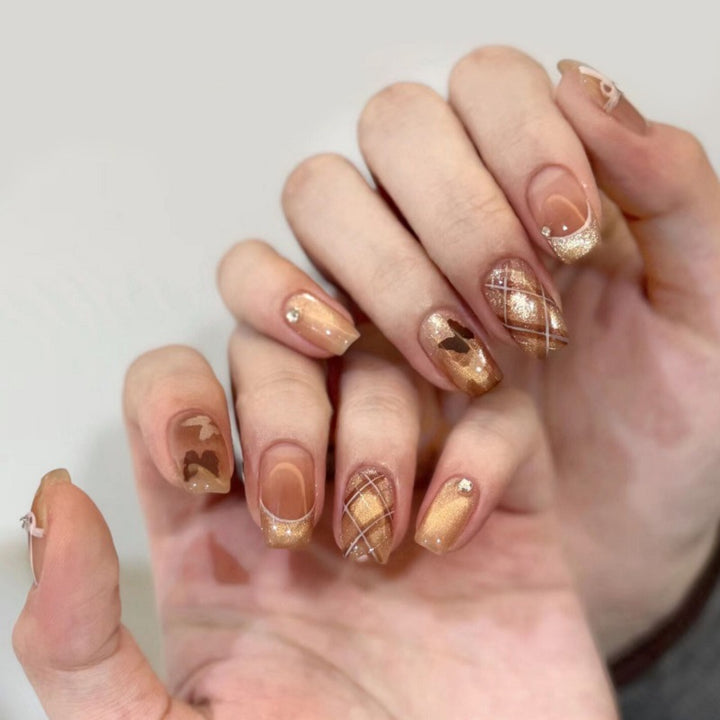 Dekoratives Press-On-Nagelset mit Stern- und Schleifenmotiven Karnz