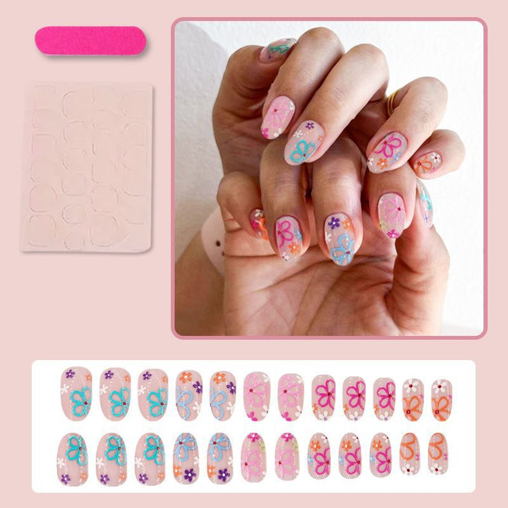 Kunstnagelset mit bunten Blumenmotiven Karnz