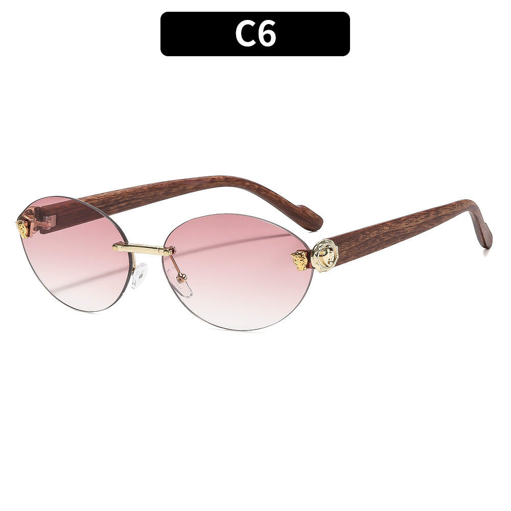 Vintage ovale Sonnenbrille mit goldenen Akzenten