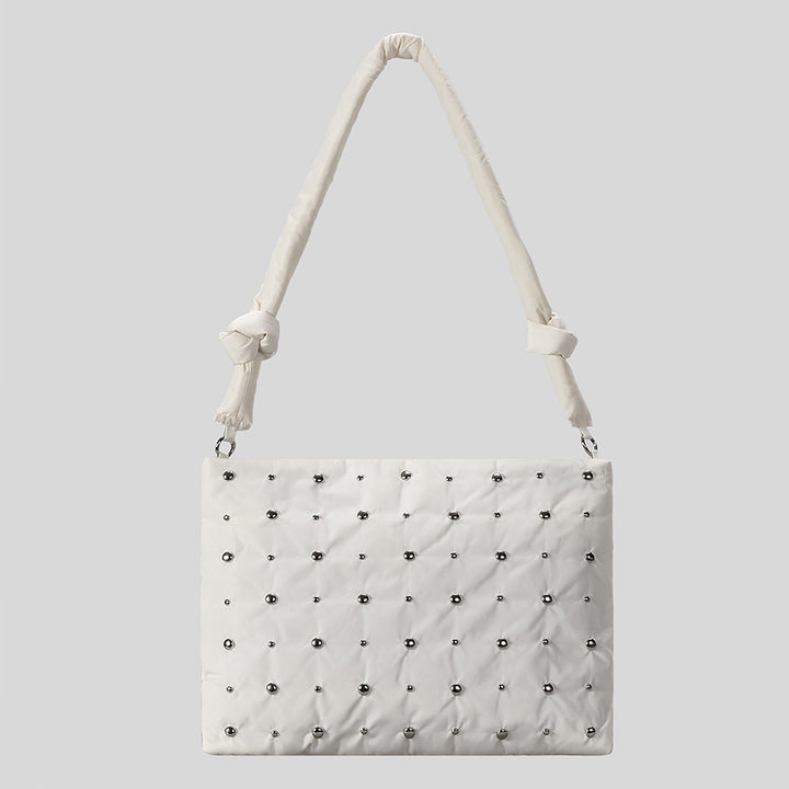 Dekorativer gesteppter Handtasche