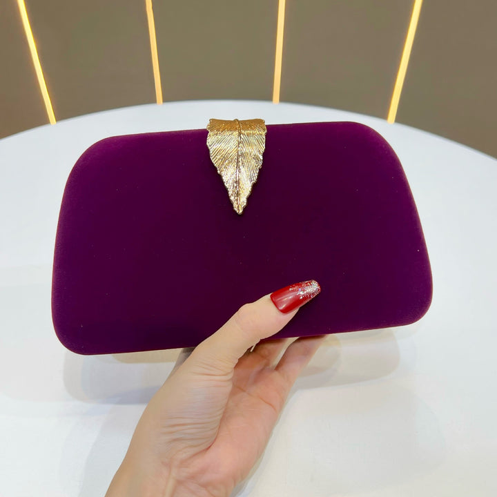 Elegante abendhandtas mit Blattakzenten