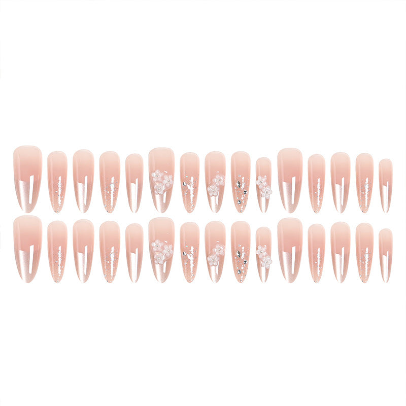 Kunstnagelset mit floralen 3D-Applikationen und Glitzerakzenten Karnz