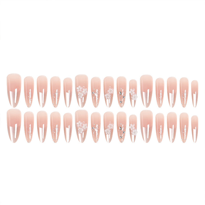 Kunstnagelset mit floralen 3D-Applikationen und Glitzerakzenten Karnz