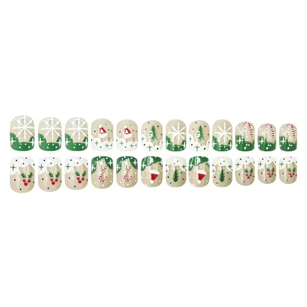 Kunstnagelset mit weihnachtlichen Motiven und Glitzerakzenten Karnz