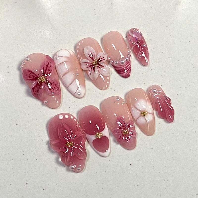 Kunstnagelset mit floralem Design und Glitzerakzenten Karnz