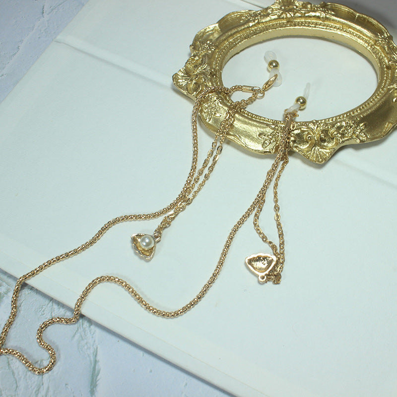 Elegante Kette mit Grünem Stein und Goldenen Akzenten Karnz