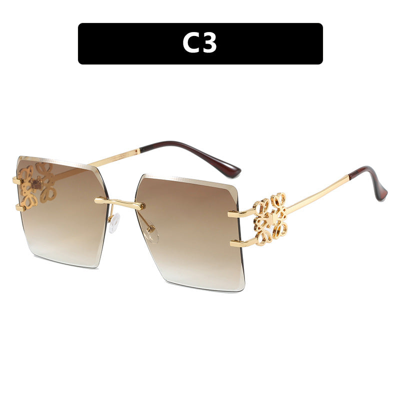 Damen modische Sonnenbrille mit außergewöhnlichem Design und goldenen Akzenten Karnz
