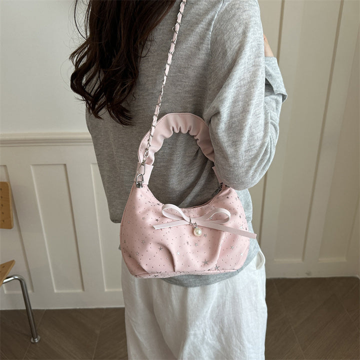 Elegante Handtasche mit Schleifendetail und Sternenprint
