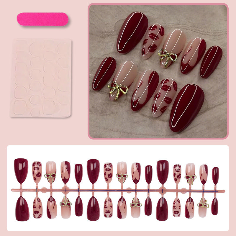 Kunstnagelset mit eleganten Schleifen- und Kussmund-Designs Karnz