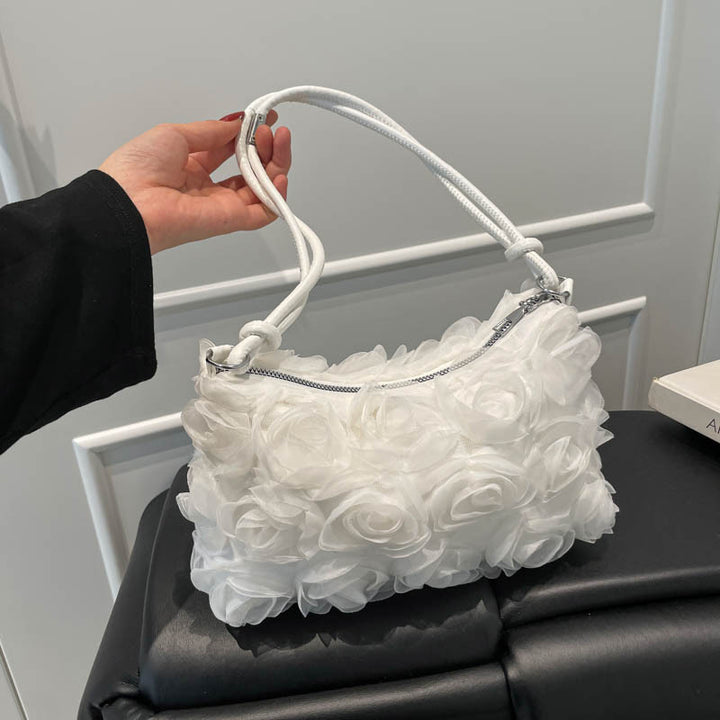 Blumenverzierte Handtasche