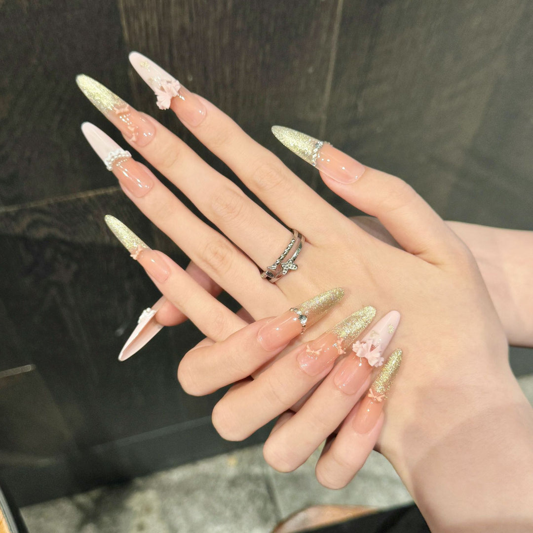 Elegante Stiletto Press-On-Nagelset mit Blumen- und Glitzerelementen