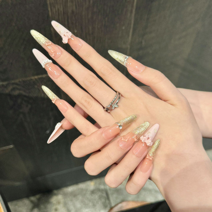 Elegante Stiletto Press-On-Nagelset mit Blumen- und Glitzerelementen