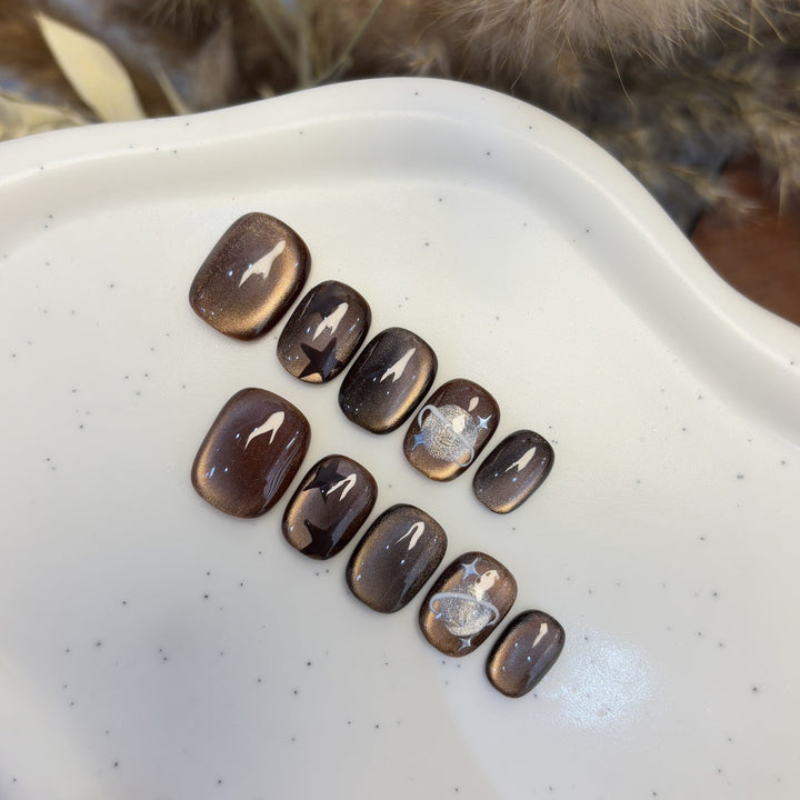 Kunstnagelset mit Sternen- und Planetendesign Karnz