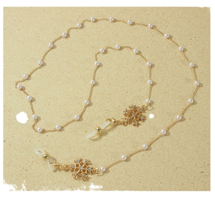 Elegante Brillenhalterkette mit Perlen und Schneeflockenanhänger Karnz