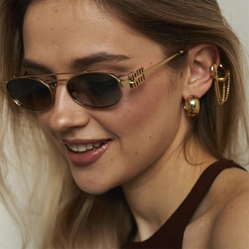 Damen elegante ovale Sonnenbrille mit luxuriösem Metallrahmen Karnz