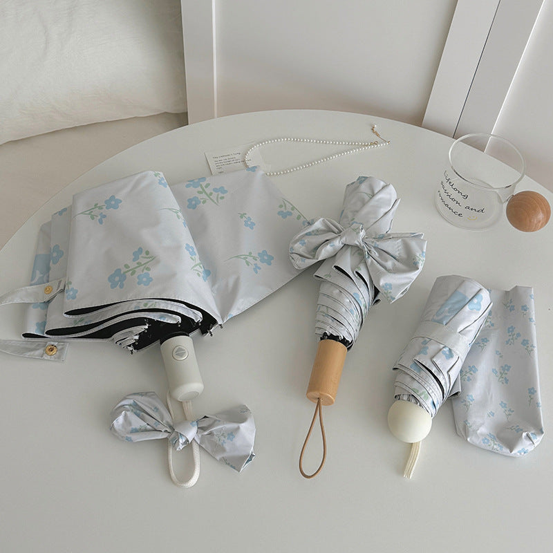 Damen Faltender Regenschirm mit stilvollem Blumendesign Karnz