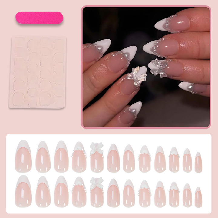 Kunstnagelset mit eleganten Spitzen und verspielten Schleifendetails Karnz