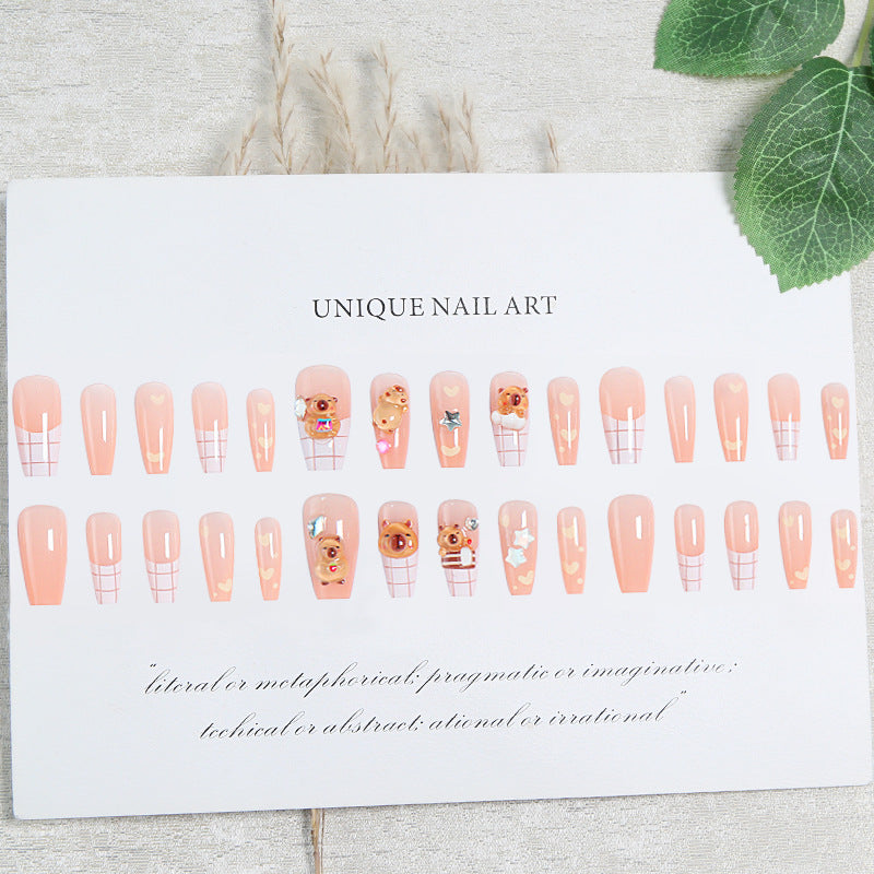Kunstnagelset mit charmantem Tierdesign und funkelnden Kristallverzierungen Karnz