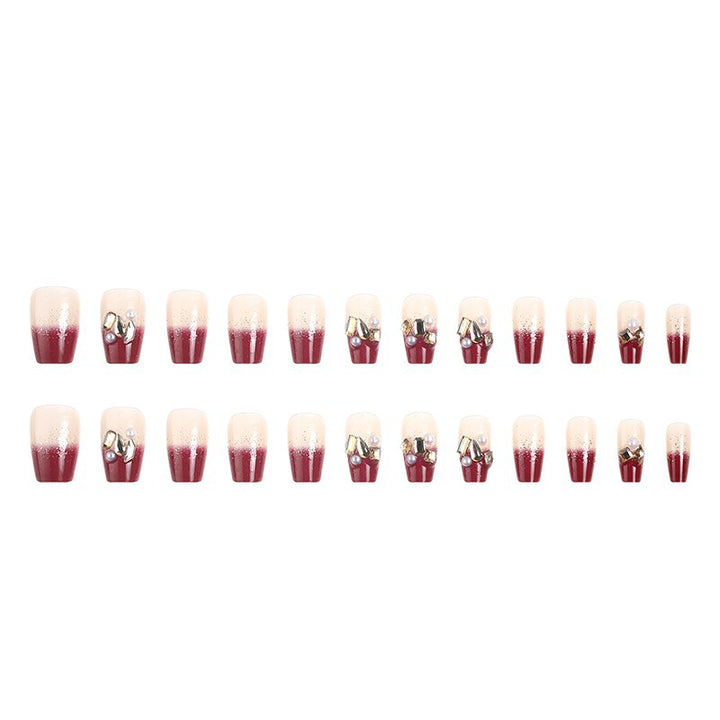 Kunstnagelset mit eleganten Glitzer- und Blumenakzenten Karnz