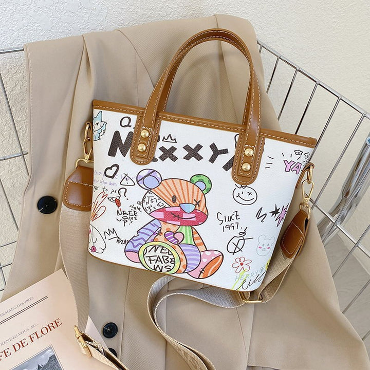 Verspielte illustrierte Schultertasche