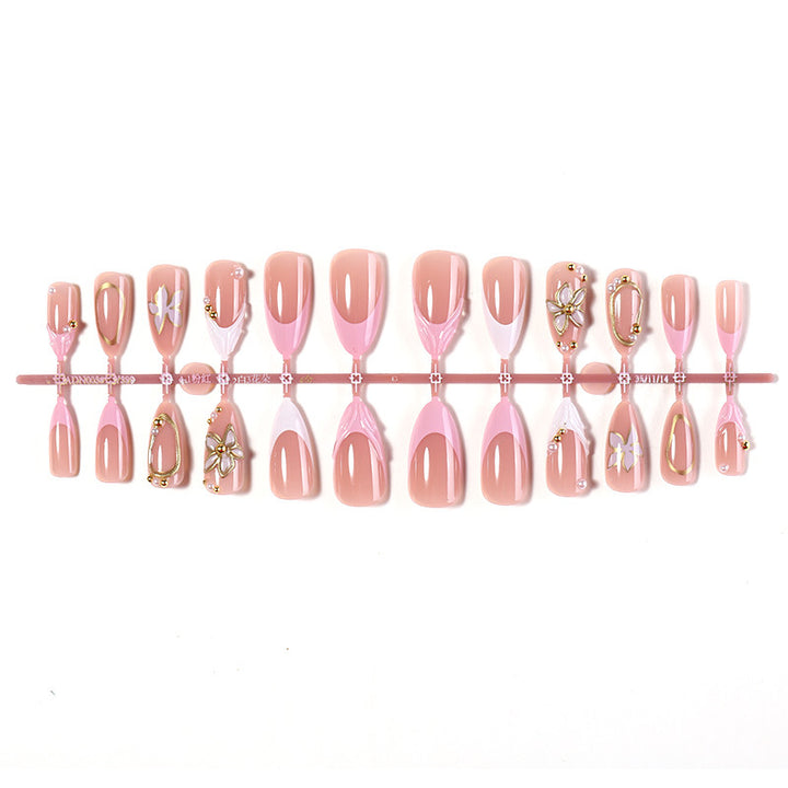 Dekorativer Press-On Nagelset mit floralen Designs Karnz