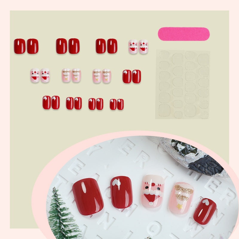 Kunstnagelset mit festlichen Weihnachtsmotiven und Glitzerakzenten Karnz